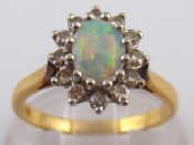 Appraisal: A yellow metal tests carat gold opal and diamond ring