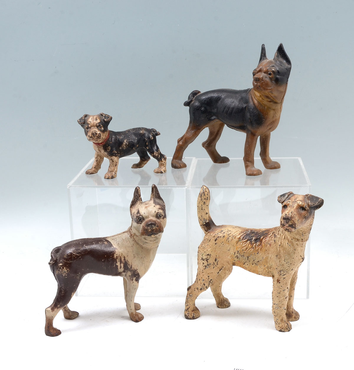 Appraisal: CAST IRON DOG DOORSTOPS Comprising - Solid cast iron dog