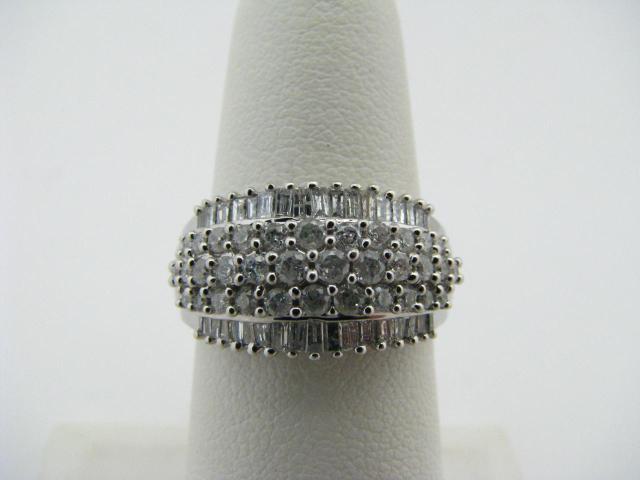 Appraisal: K White Gold dome ring with baguette and round diamonds