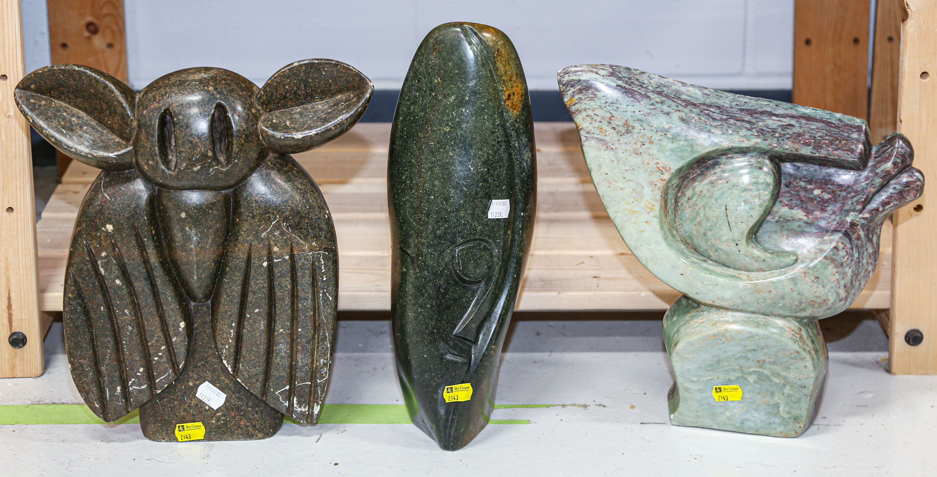 Appraisal: THREE ABSTRACT SHONA SOAPSTONE SCULPTURES to in H