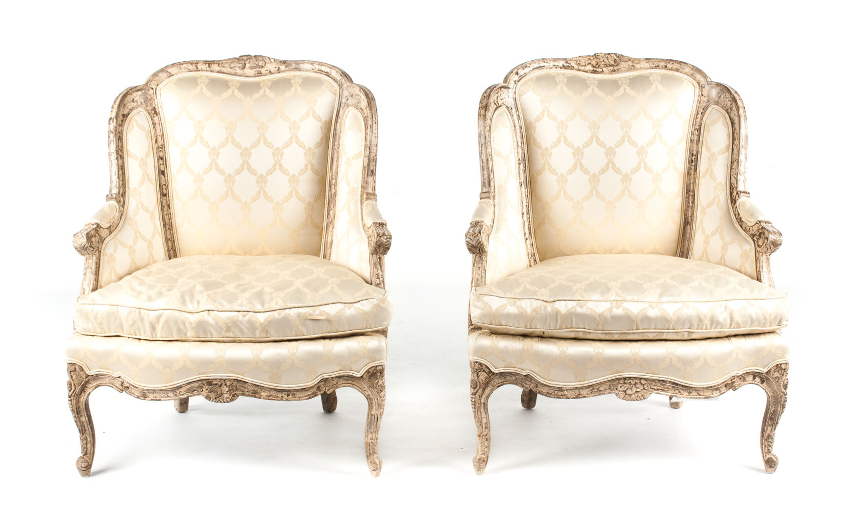 Appraisal: Pair of Louis XV style upholstered armchairs floral carved pickled