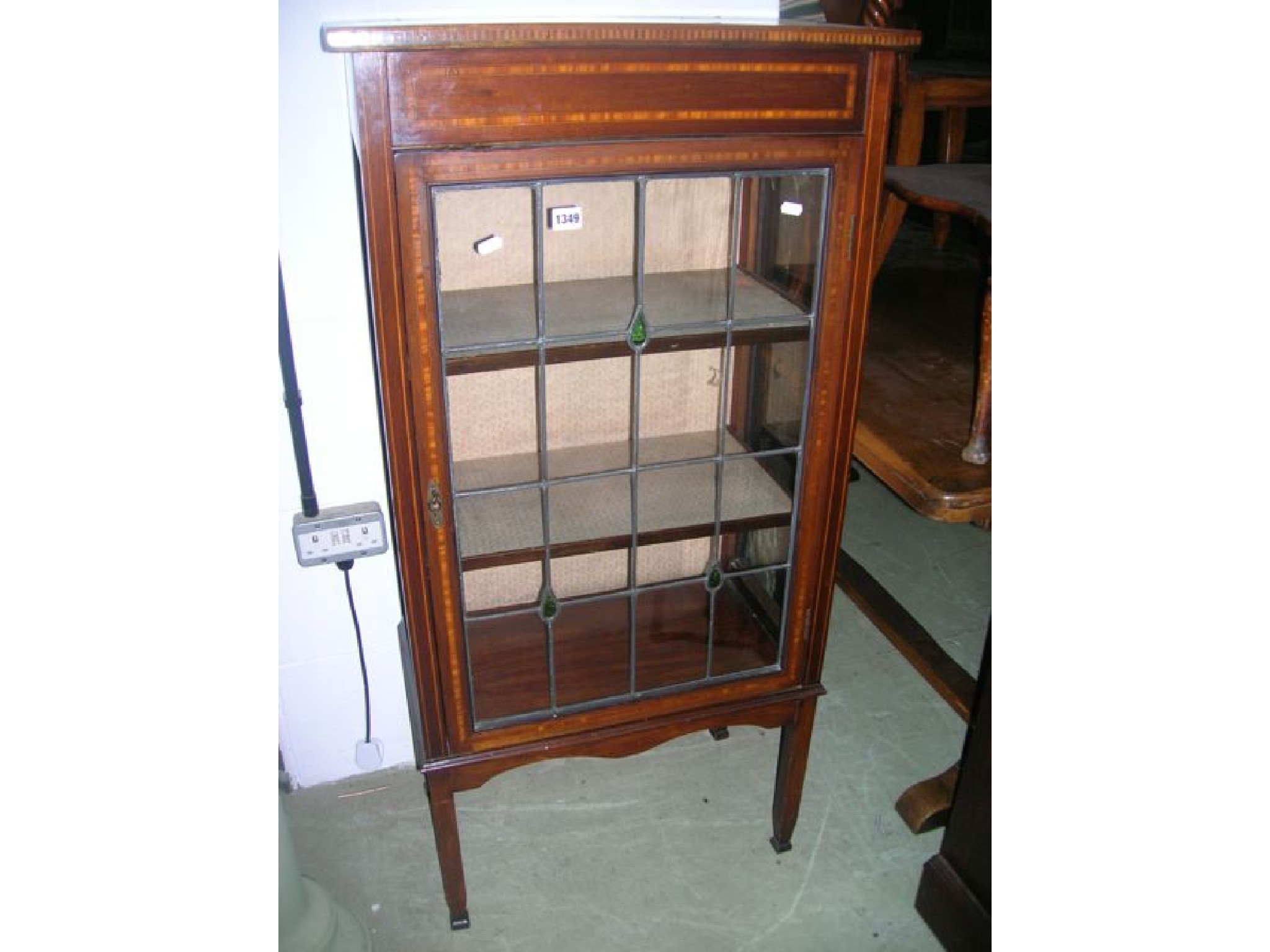 Appraisal: A small inlaid Edwardian mahogany freestanding display cabinet with satinwood