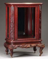 Appraisal: CARVED ONE DOOR MIRROR BACK CABINET Small cabinet with a