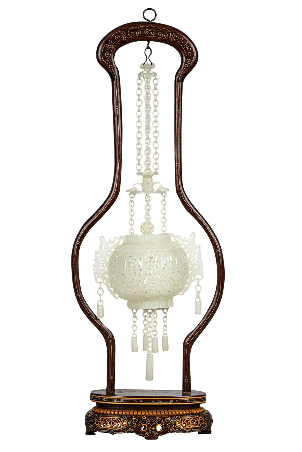 Appraisal: CHINESE CARVED WHITE JADE HANGING CENSERhanging from a carved wood