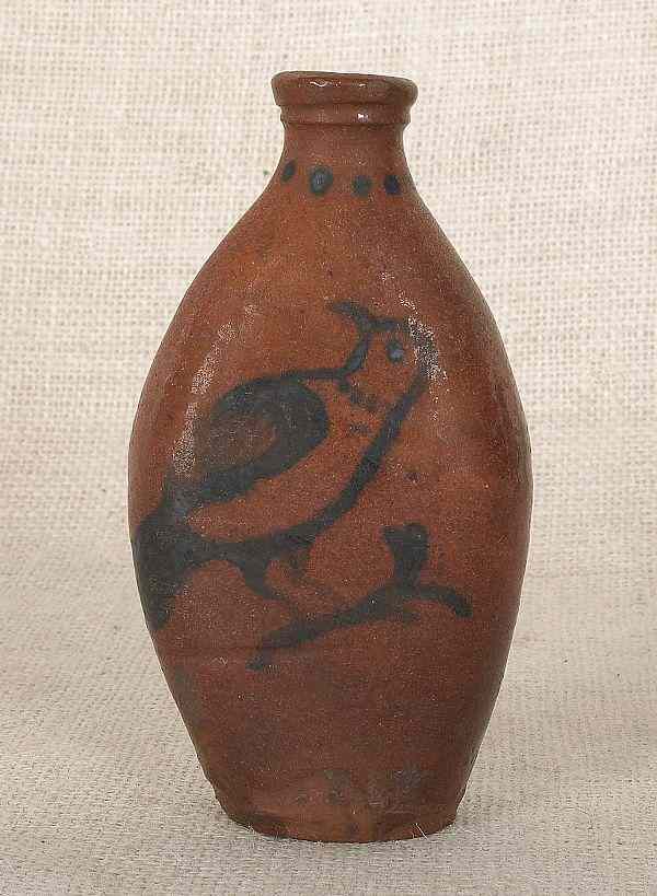 Appraisal: Pennsylvania redware flask th c with manganese bird and flower