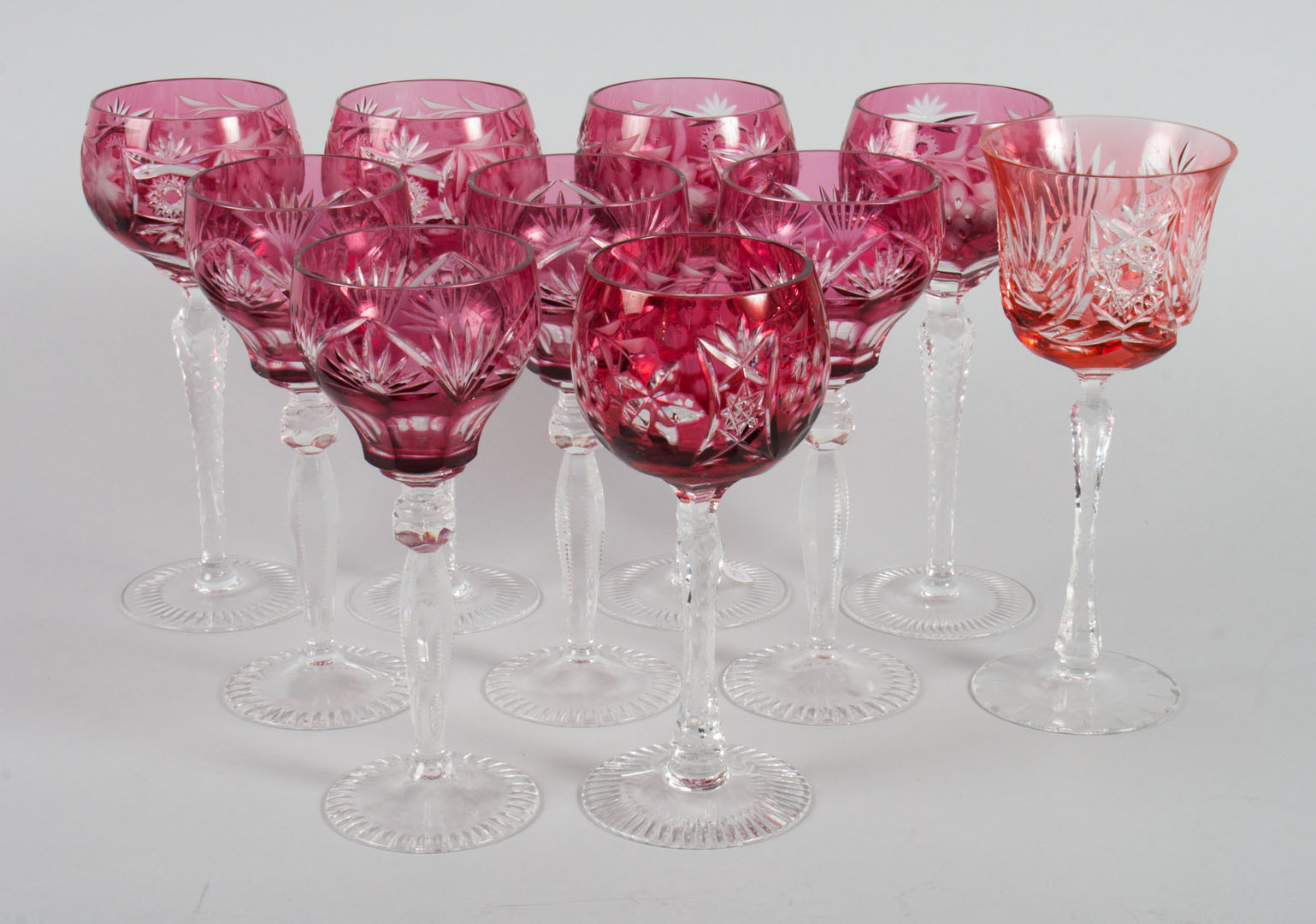 Appraisal: Czecho-Bohemian wine stems assembled cranberry cut-to-clear glass stems in H