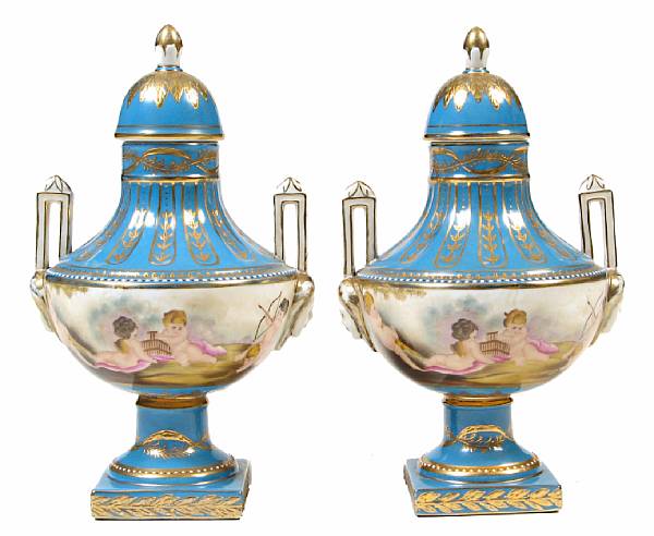 Appraisal: A pair of porcelain paint decorated covered vases modern height