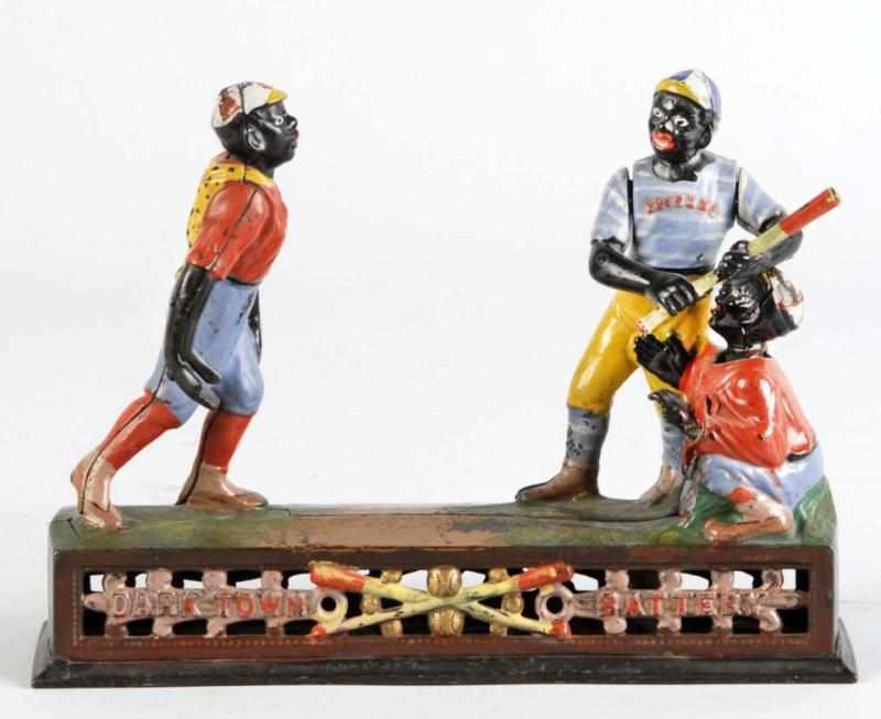 Appraisal: Cast Iron Darktown Battery Mechanical Bank Description Manufactured by J