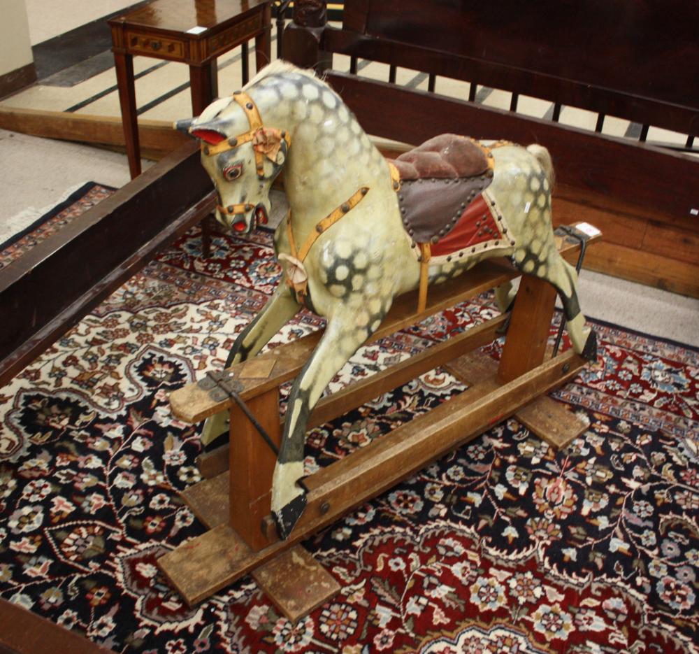 Appraisal: CHILD'S ROCKING HORSE ON STAND a paint-decorated solid wood horse