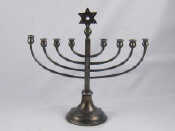 Appraisal: A silver plate menorah cm across