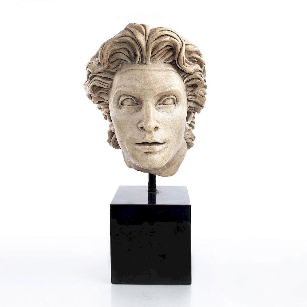 Appraisal: LARGE NEOCLASSICAL SCULPTURAL MOUNTED BUST Hellenistic styled patinated plaster presented