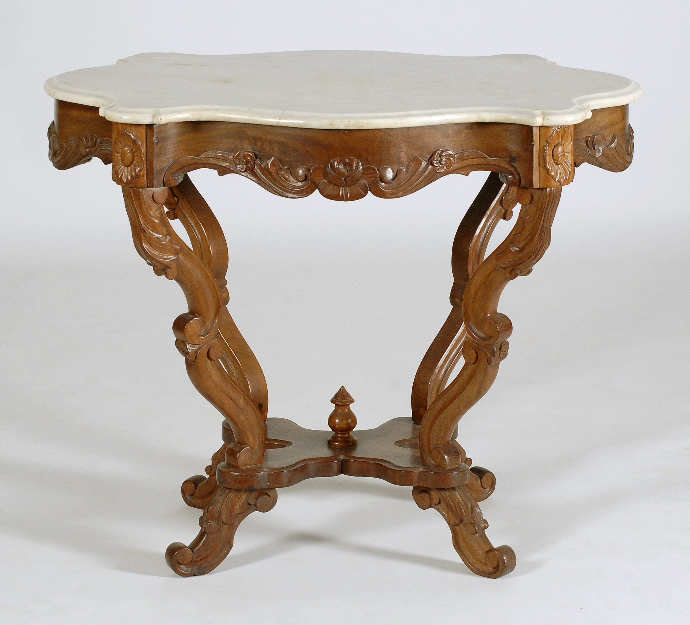 Appraisal: VICTORIAN TURTLE-TOP LAMP TABLE In walnut with white marble top