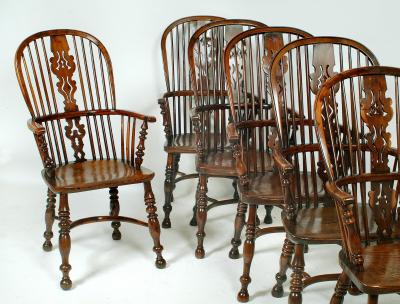 Appraisal: A COMPOSITE SET of six yew Windsor armchairs th century