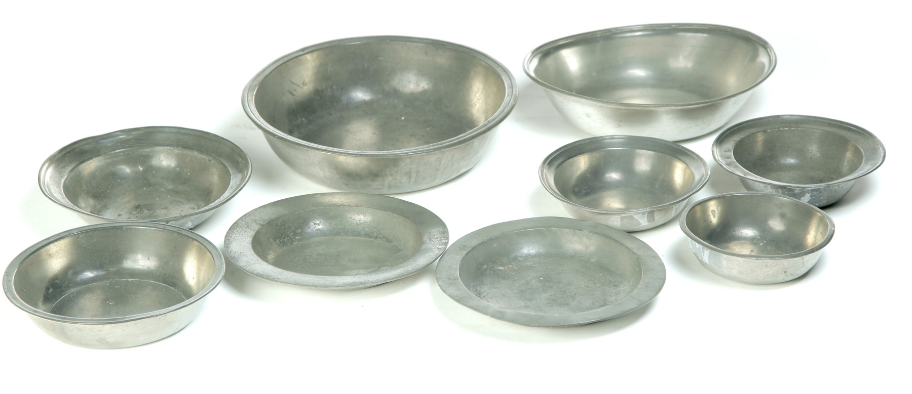 Appraisal: NINE PEWTER BASINS AND SHALLOW BOWLS European th century Basin