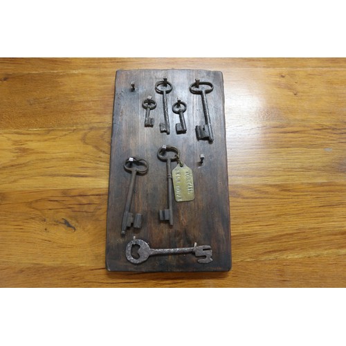 Appraisal: Antique French iron keys on wooden backboard approx cm x