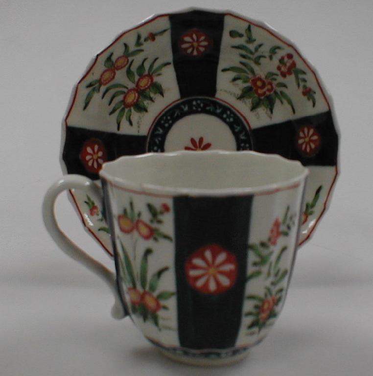 Appraisal: A First period Worcester style cup and saucer with faux