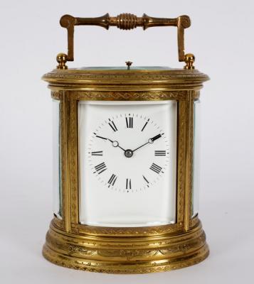 Appraisal: A gilt brass carriage clock in an oval engraved case