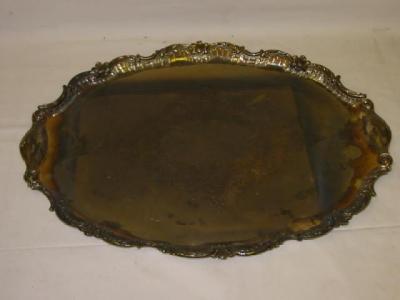 Appraisal: AN EDWARDIAN TRAY of oval form with scroll moulded border