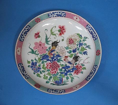 Appraisal: A CHINESE FAMILLE ROSE CHARGER decorated with cockerels perched on