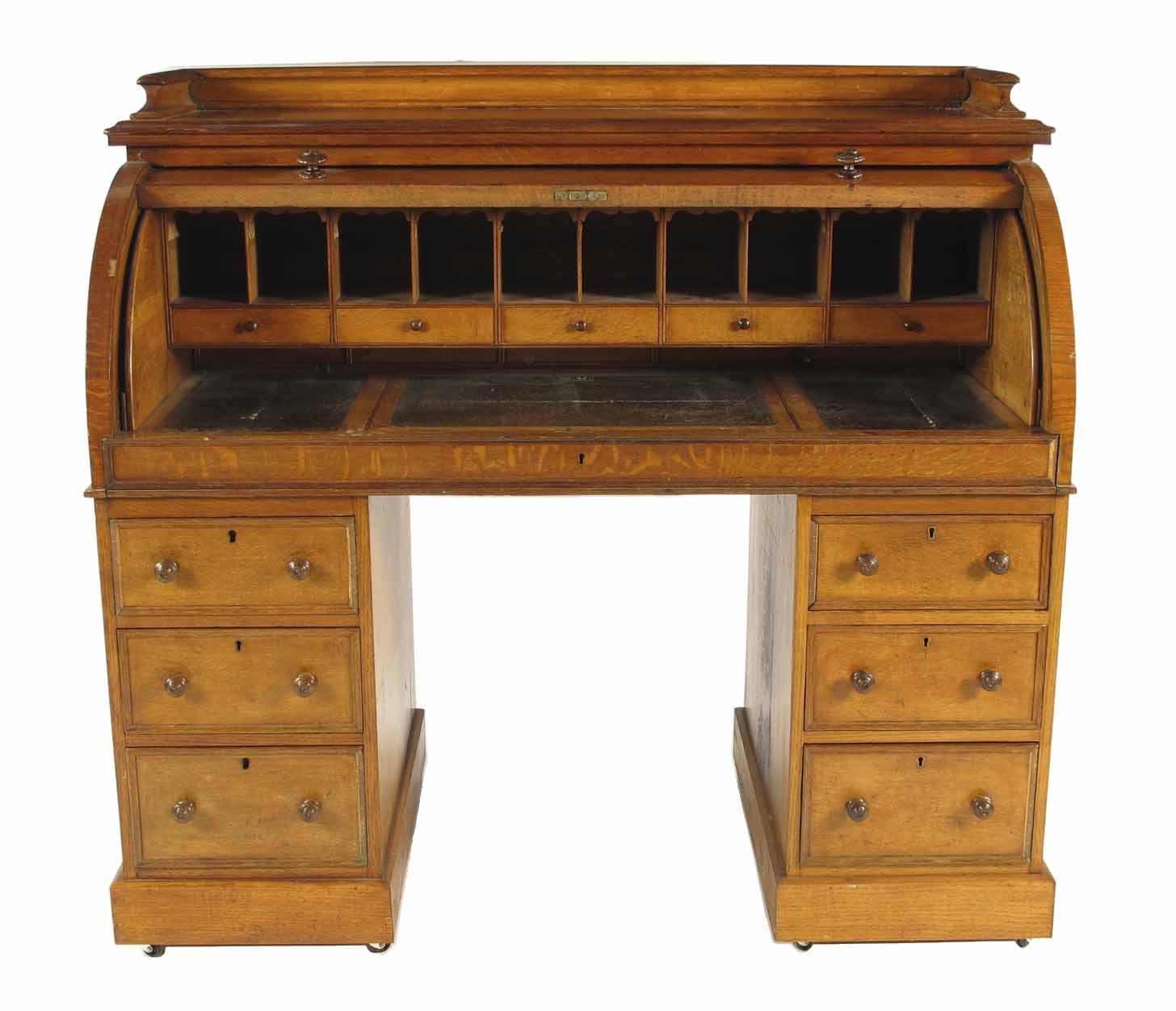 Appraisal: A Victorian oak twin pedestal cylinder desk