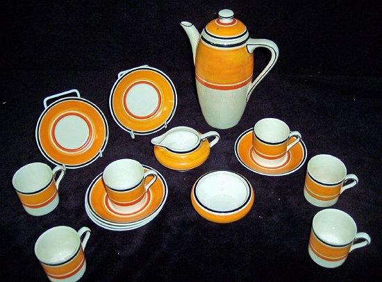 Appraisal: A Grays Pottery coffee service with bands in black orange