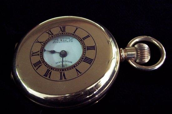 Appraisal: A gold plated half hunter Waltham pocket watch Coventry Lever