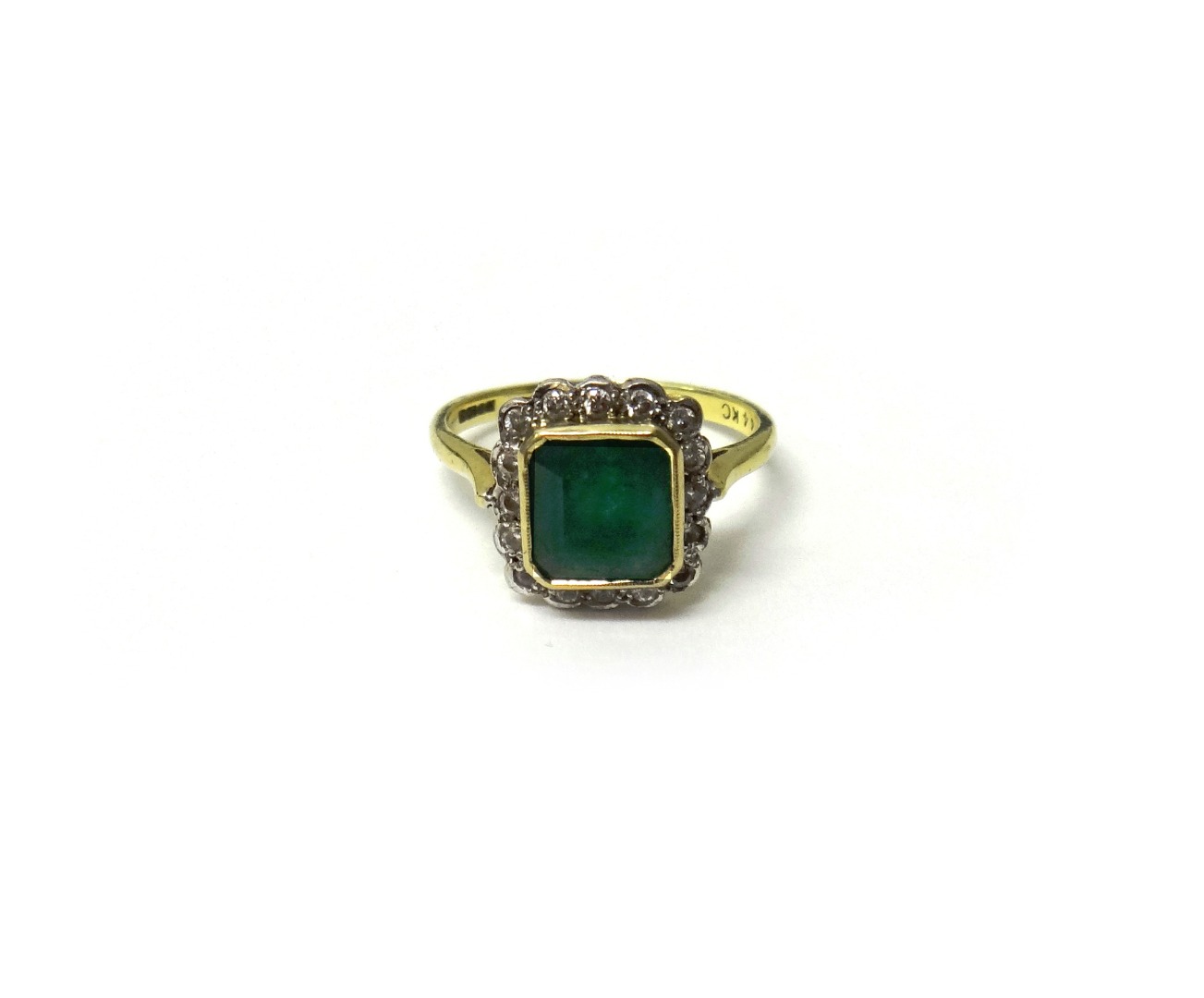 Appraisal: An ct gold emerald and diamond square cluster ring mounted