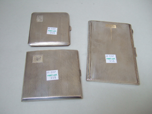 Appraisal: Three silver cigarette cases each engine turned to the exterior