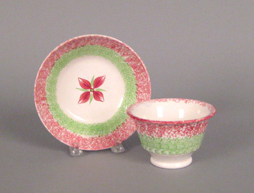 Appraisal: Red and green rainbow spatter cup and saucer th c