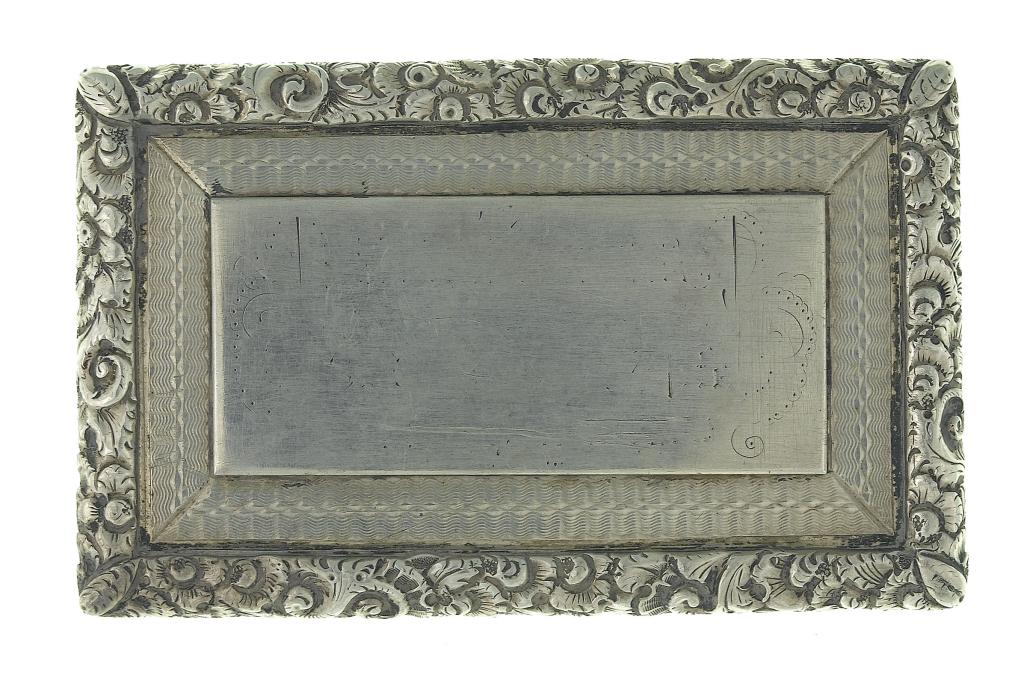 Appraisal: A VICTORIAN SILVER RECTANGULAR SNUFF BOX engine turned in foliate