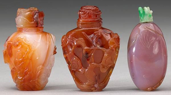 Appraisal: Four agate snuff bottles Including one of carnelian agate decorated