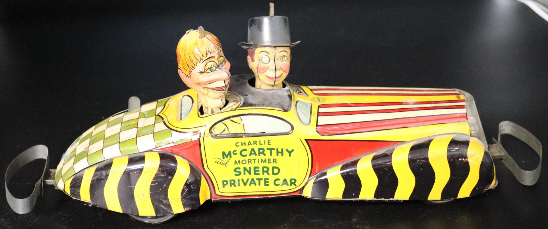 Appraisal: Tin Marx Charlie McCarthy Snerd Private Car Toy We'll Mow