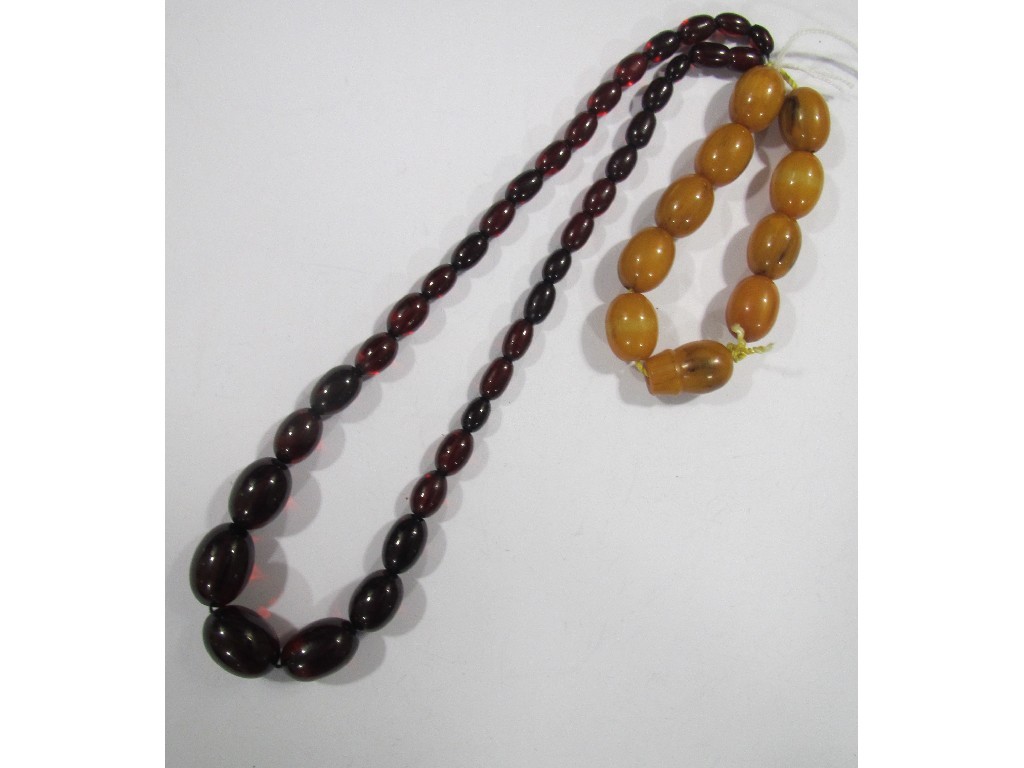 Appraisal: Lot comprising an amber bead bracelet and a string of