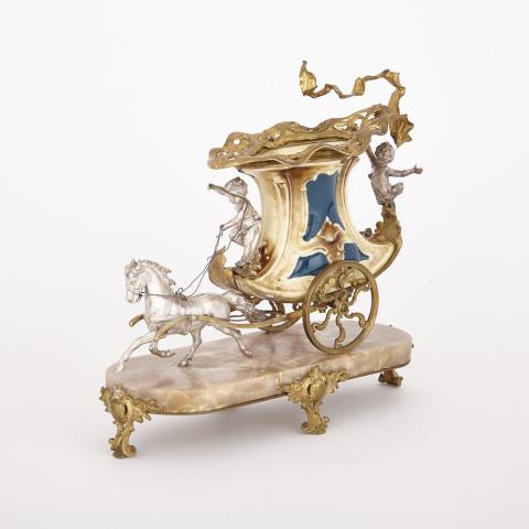 Appraisal: Austrian Silvered and Gilt Bronze Mounted Pottery Carriage Form Centerpiece