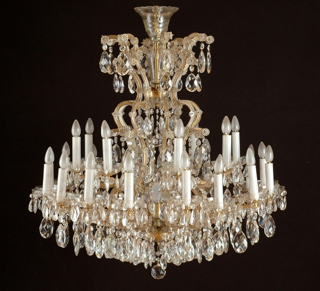 Appraisal: AN IMPRESSIVE CRYSTAL CHANDELIER With a lobed stem emanating sixteen