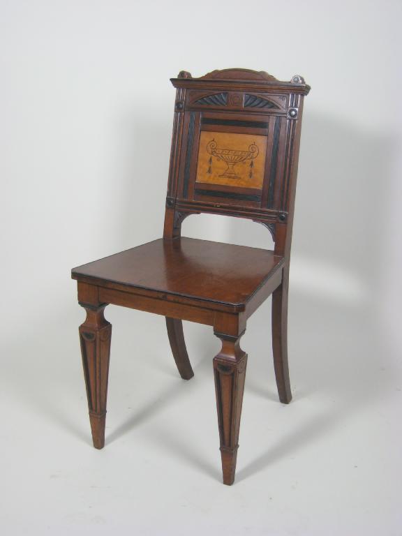 Appraisal: A Victorian walnut aesthetic movement Hall Chair with solid panelled