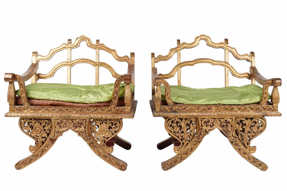 Appraisal: PAIR SOUTHEAST ASIAN CARVED GILT WOOD ARMCHAIRSeach with two loose