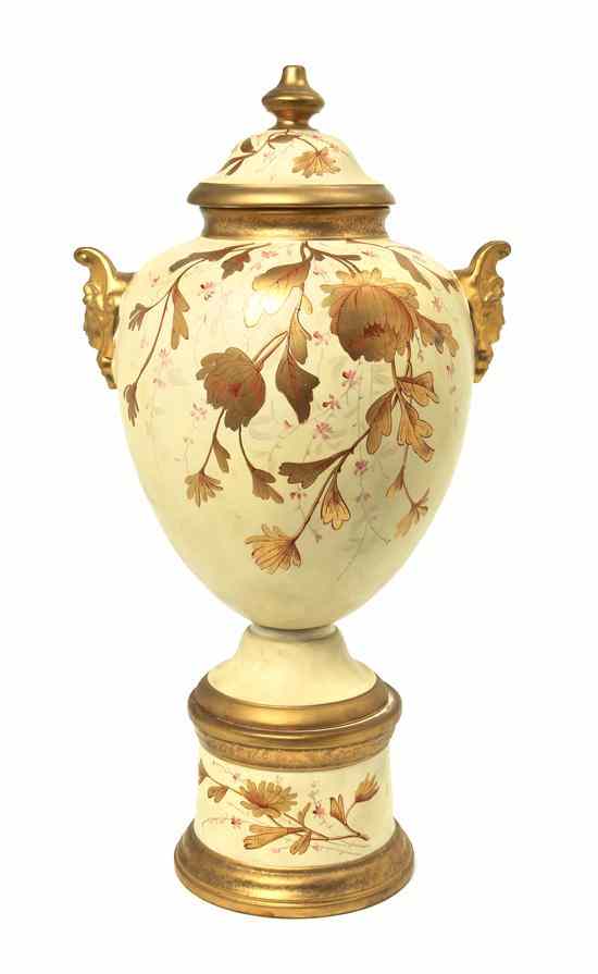 Appraisal: A Continental Porcelain Covered Urn having gilt accented foliate decoration