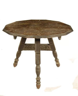 Appraisal: A carved oak folding tripod table the dodecagonal moulded edge