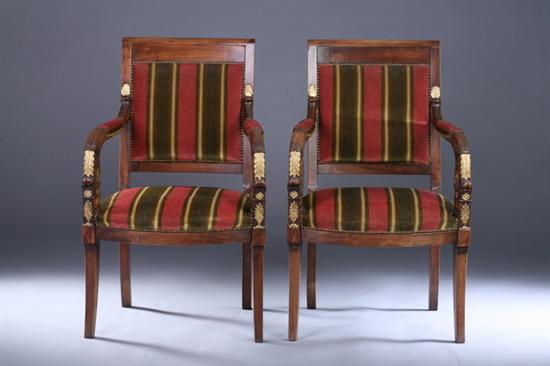 Appraisal: PAIR FRENCH EMPIRE STYLE CARVED FRUITWOOD FAUTEUILS th century with