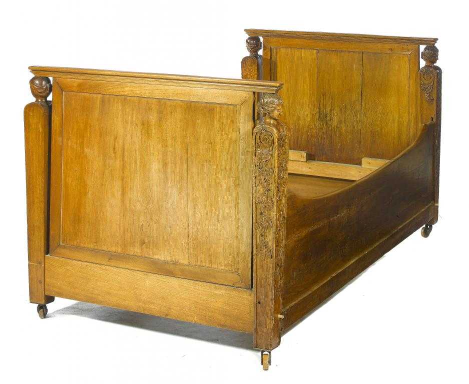 Appraisal: A CHARLES X FRUITWOOD LIT EN BATEAU the panelled head