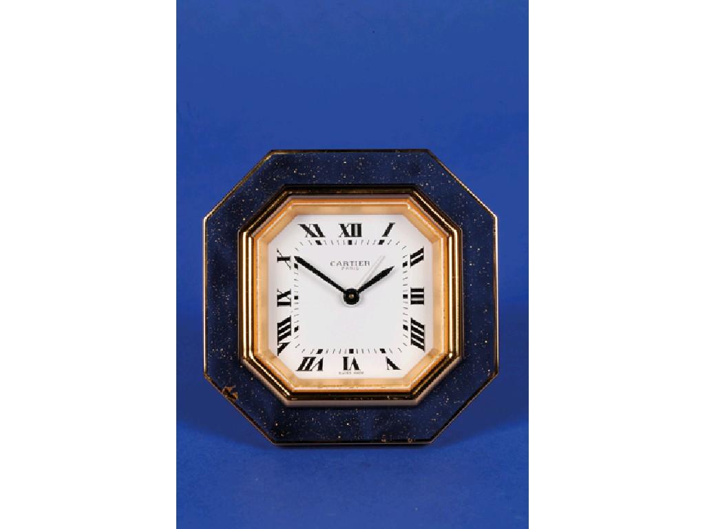 Appraisal: A CARTIER TRAVELLING CLOCK the white octagonal dial inscribed Cartier