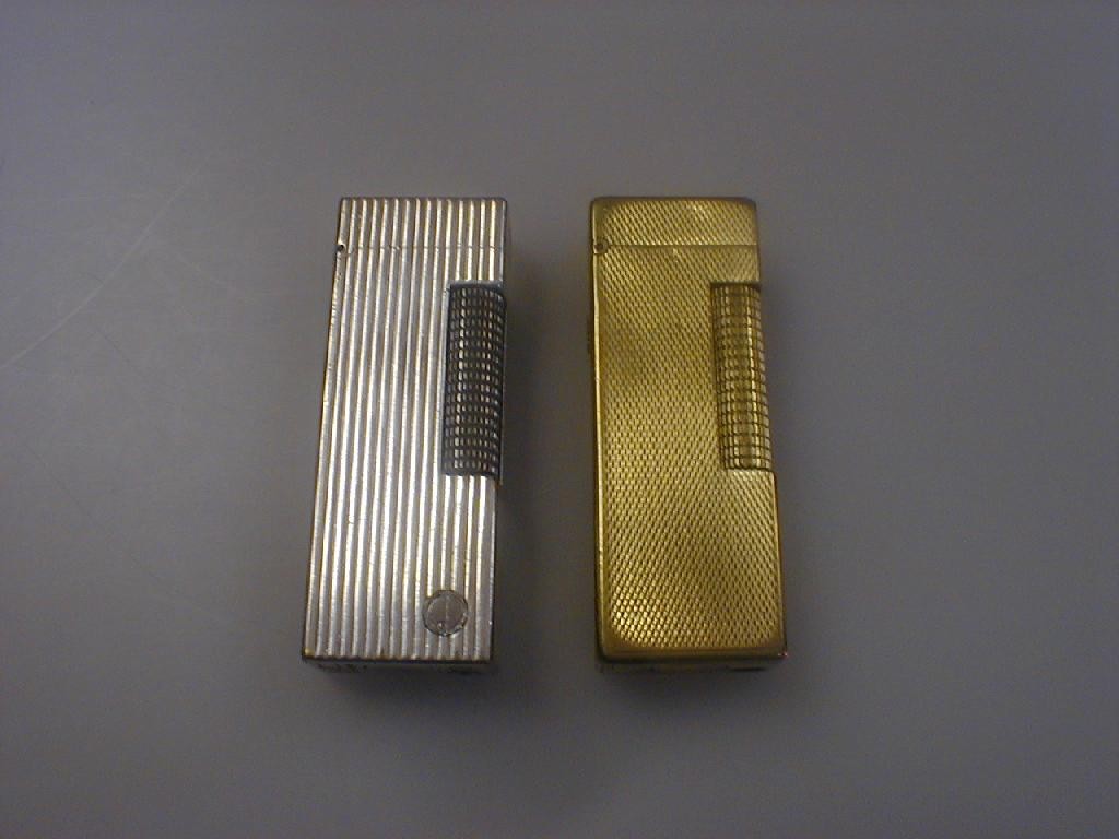 Appraisal: Two Dunhill cigarette lighters 's style rectangular column with engine