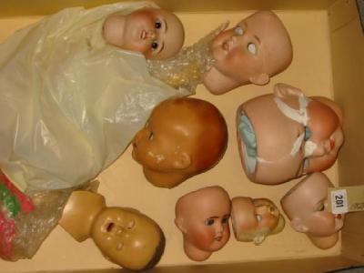 Appraisal: Various bisque dolls heads and one composition head some damage