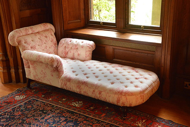 Appraisal: A MAHOGANY CHAISE LONGUE the scrolling end and arms with