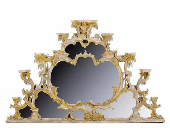 Appraisal: English Rococo giltwood overmantel mirror early th century flowing scroll-and-foliate