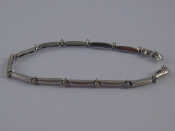 Appraisal: A white metal tests carat gold diamond bracelet approx cm