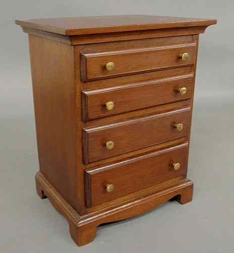 Appraisal: Miniature Chippendale style mahogany highcase th c with dovetailed construction