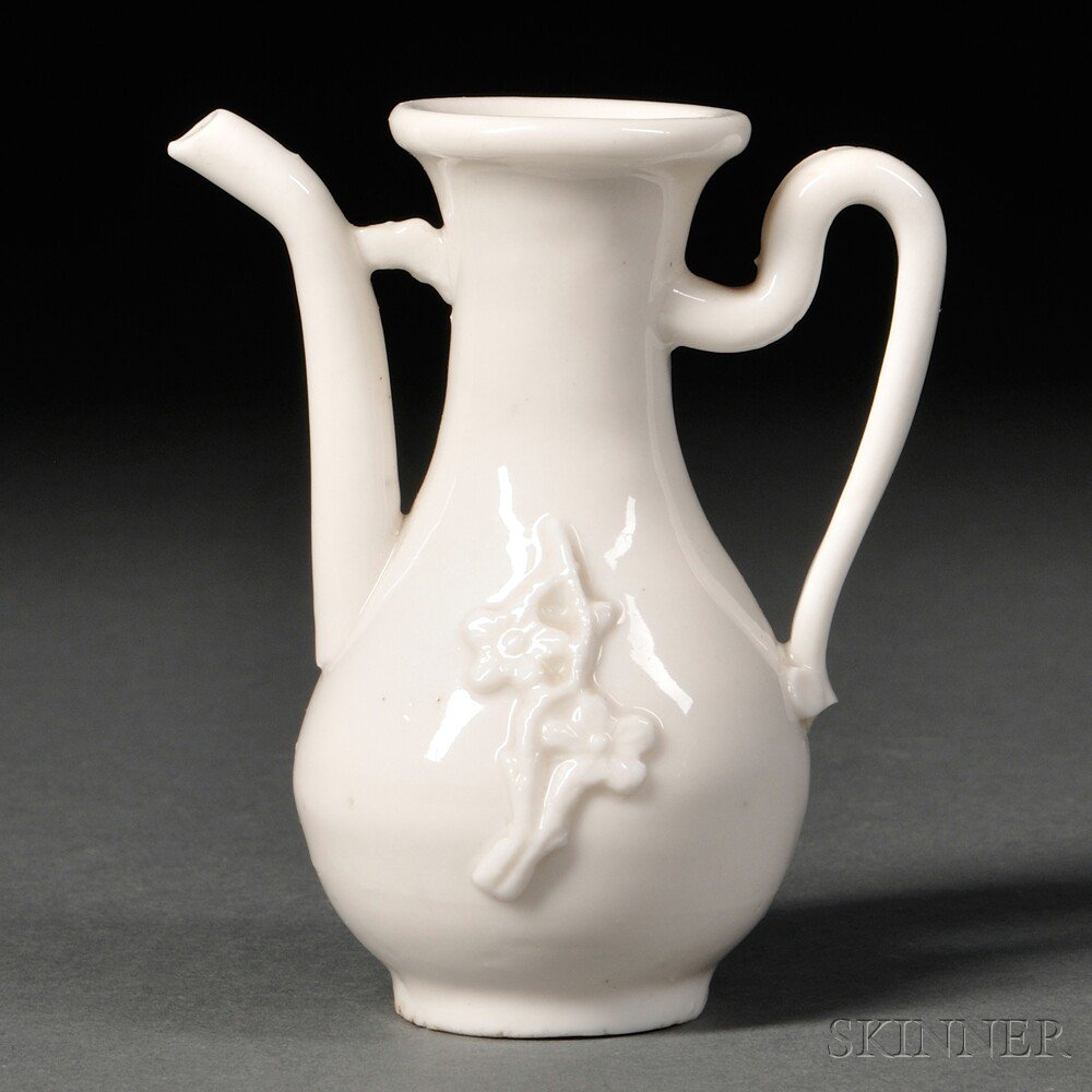 Appraisal: Blanc-de-Chine Ewer China Qing Dynasty decorated with applied prunus sprays