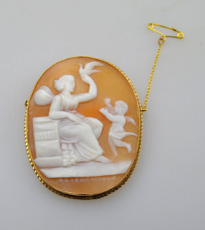 Appraisal: Large oval shell cameo brooch of angel with cherub and